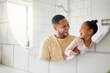 © peopleimages.com - Bathroom, happy and dad with child in mirror for dental hygiene, brushing teeth and cleaning. Health, family and father with girl for learning skincare, wellness and washing for morning routine