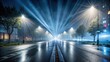 © yuwaree - Foggy street with searchlight and laser beams illuminating wet asphalt