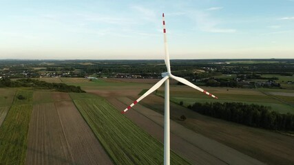 Wall Mural - Green energy wind turbine at sunset