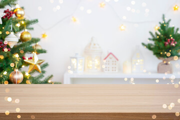 Wall Mural - beautiful out of focus christmas fir tree and new year holiday decoration with empty wooden table fo