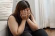 © Charlie's - Sad Overweight plus size woman thinking about problems on sofa upset girl feeling lonely and sad from bad relationship or Depressed woman disorder mental health