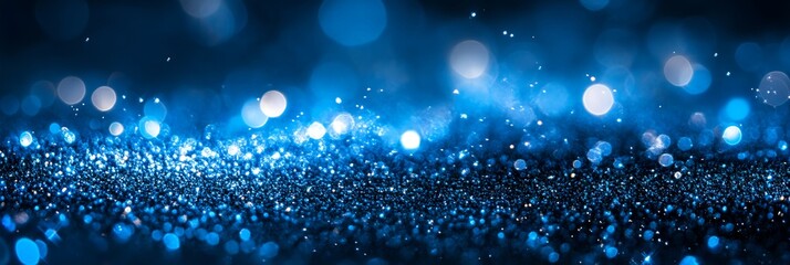 Poster - A blue background with many small blue dots. The dots are scattered all over the background, creating a sense of movement and energy. The image conveys a feeling of excitement and liveliness