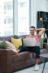 Poster - Couch, laptop and remote work with man thinking, smile and creative web design for company homepage. Freelancer, working and technology with content creation and ux update with email and online job