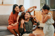 © peopleimages.com - Support, airplane and picture with family on sofa for love, playful game and photography. Care, bonding and memory with child on shoulders of parent in living room at home for silly, camera and funny