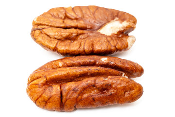 Pecan nuts in air on white background