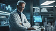 © romanets_v - Experienced scientist analyzing data in modern laboratory with advanced technology equipment