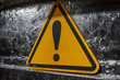 © Butsarakham - A triangular warning sign in bright yellow with a black exclamation mark, indicating caution or a potential hazard.
