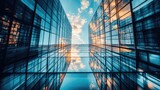 Dramatic architectural shot of a modern skyscraper with a glass fade, reflecting the surrounding city and sky in bold detail -