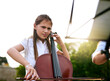 © peopleimages.com - Nature, music and child with cello angry for playing, practice and learning skills outdoors. Upset, confused and young girl with musical instrument for talent show, performance and concert recital