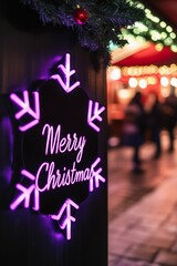 Merry Christmas purple led neon sign in the shape of a snowflake in a Christmas market by night in the city street. Vertical Photography (2:3)