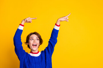 Aufkleber - Photo portrait of attractive young woman point funky empty space dressed stylish blue knitted clothes isolated on yellow color background