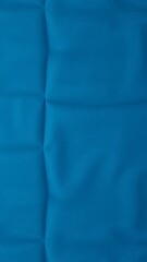 Poster - Blue textile background with subtle folds, perfect for design projects, fabric textures, or as a backdrop in creative compositions