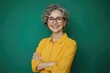 © Vii - A woman wearing a yellow shirt and glasses, possibly for reading or working