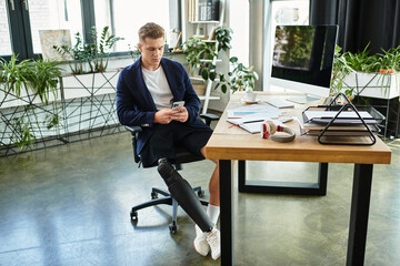 A determined businessman with a prosthetic leg focuses on his work at a stylish office desk filled with tasks.