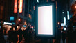 © Creative mind - Blank illuminated billboard in city street at night. Empty advertising screen glowing for your advertisement on busy urban street.