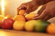 © Larisa - Hands arranging fruits for Kwanzaa celebration, warm tones