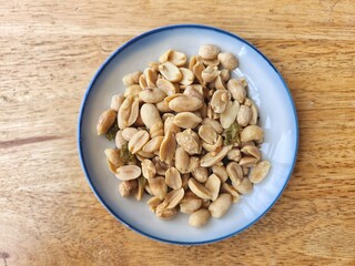 Wall Mural - Peanut nut and dried fruit on wood background