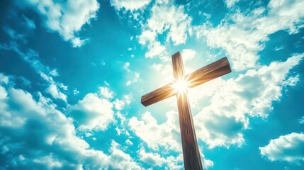 Wooden cross standing tall against a cloudy sky