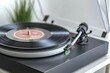 © Kanisorn - Label discographies showcased on a classic turntable with headphones, retro vibe, gently blurred to enhance a sense of nostalgia.