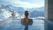 © liliyabatyrova - A woman is sitting in a pool of water, looking out at the mountains