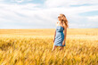 © Константин Плотников - Russia, Republic of Tatarstan, Kalmash village, August 01, 2024, 17:00, girl in a dress in a wheat field in summer