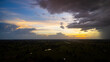 © Mohwet - Rain clouds and black sky textured background. Danger storm cloud, Black cloud and thunder storm, Dark sky and motion clouds before Sunset and sunrise.Beautiful red and orange sunset.