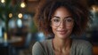 © Vesna - cheerful businesswoman radiating confidence in a stylish office boardroom laptop open bright lighting enhancing her professionalism and positive demeanor