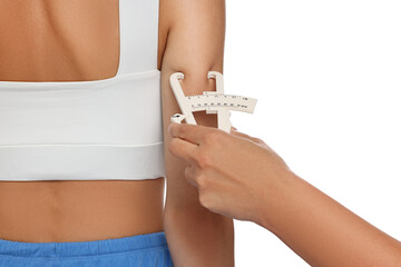 Sticker - Nutritionist measuring woman's body fat with caliper on white background, closeup