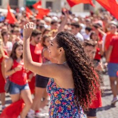 seville, portugal - may 1 6, 2 0 1 8 : young people dressed in red with traditional dress and flamenco performing on a square during