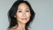 © lucegrafiar - Portrait of a middle-aged Asian woman with a serene look. Cosmetology, beauty, skincare concept