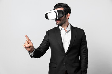 Project manager with virtual reality glasses looking at data analysis while analyzing and pointing data. Skilled business man using VR goggle and digital innovation while enter metaverse. Deviation.