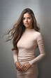 © N Hiraman/peopleimages.com - Portrait, woman and pride with fashion in studio of cosmetics, stylish clothes and elegant aesthetic. Confident, girl and designer outfit as dress, glamour makeup and classy beauty on gray background