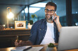 © peopleimages.com - Night, office and man with phone call, notes and laptop for online research ideas at digital agency. Late, plan and design consultant with smartphone for networking, communication or business contact