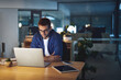 © peopleimages.com - Night, reading and man at desk with laptop, business planning or checking email at digital agency. Thinking, dark and consultant on web design report with computer, ideas or online research in office
