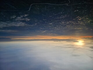 Wall Mural - Sunset Sky and Clouds from Airplane Window