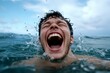 © Sanchai - A person laughing while splashing in the ocean, symbolizing the carefree joy and freedom that come from playful moments in nature