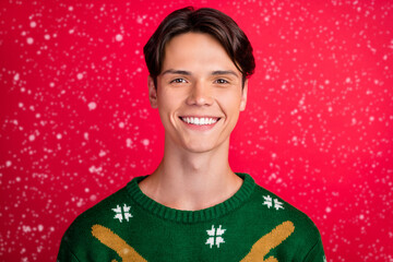 Wall Mural - Photo of cheerful sincere candid guy shiny beaming smile wear ugly sweater isolated red color background