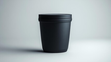 Compact collapsible black hiking cup mockup on a white background featuring minimalist design and portability for camping gear outdoor product branding or promotional material.. Generative AI