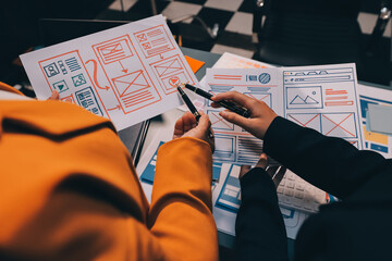 The designer team is designing the uxui system to make the uxui system work well on new phones and support system updates. Website development concept UI UX front end designer