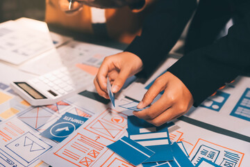 The designer team is designing the uxui system to make the uxui system work well on new phones and support system updates. Website development concept UI UX front end designer