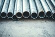 © Pumapala - Close-up of stacked metal pipes.