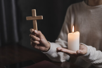 Religion concept. Human hands together forgives and blesses. Praying hands of woman with a cross.