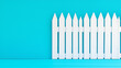 © StirfryMoJi - White Picket Fence on Blue Background