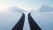 © Nitchalee N. - A serene winter landscape featuring a snow-covered road splitting into two paths, surrounded by majestic mountains under a clear sky.