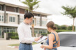 © Nittaya - Real Estate Dreams: A happy couple signs paperwork with a real estate agent, marking a major milestone in their journey to homeownership.