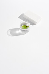 Aufkleber - Minimalist Still Life Soap and Leaf in Glass Dish on White Surface