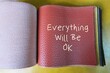 © ariya j - Red PU sample with text written Everything Will Be OK - phrase of comfort in times of stress or uncertainty - faith that the balance of life will be restored