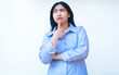 © M Alfan Setyawan - confused asian woman look thoughtful with hands on chin and folded arms wearing striped shirt  isolated on white background