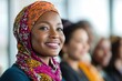 © Larisa - Smiling woman in colorful hijab with diverse group