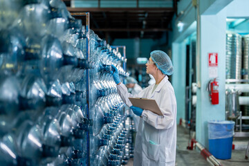 Caucasian female scientist working in laboratory at factory warehouse. 